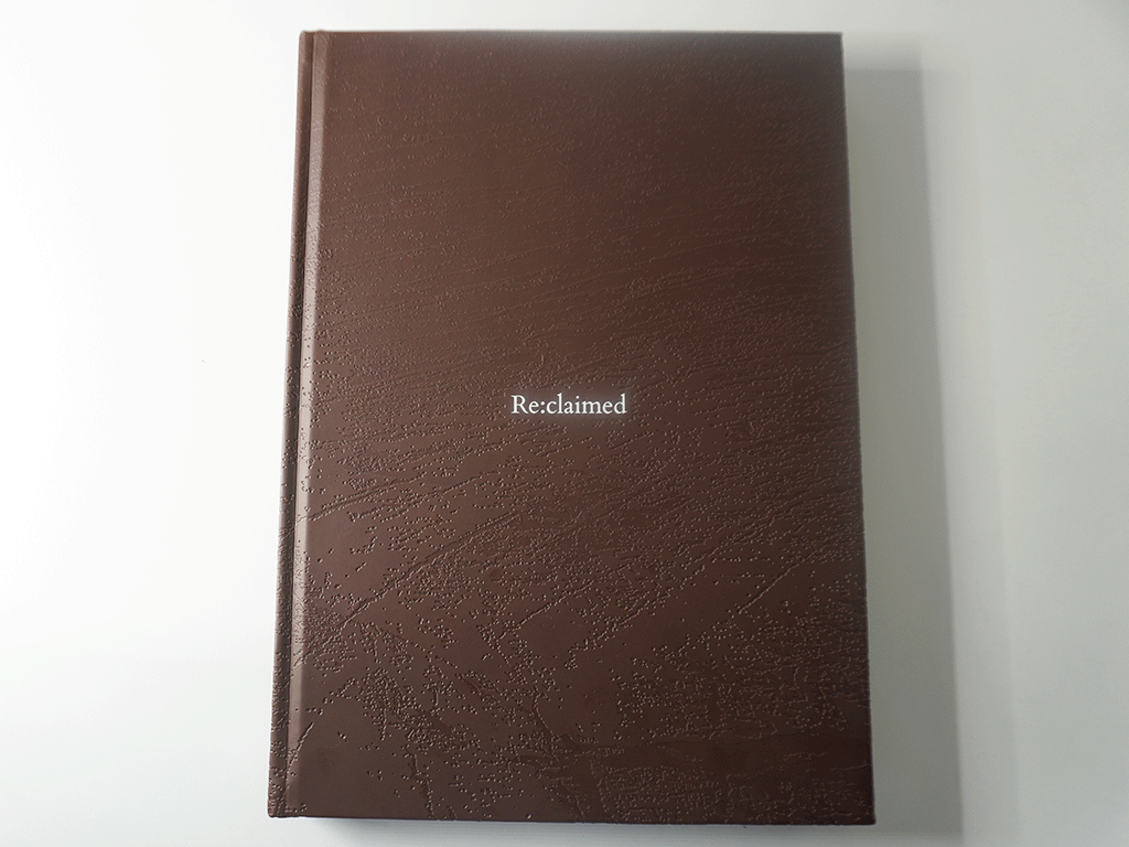 DSC09361 Premium coffee table book printing with debossed cloth cover and white foil title Reclaimed book