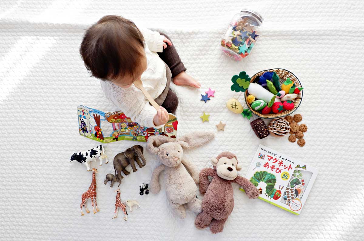 child playing with toys birds eye view